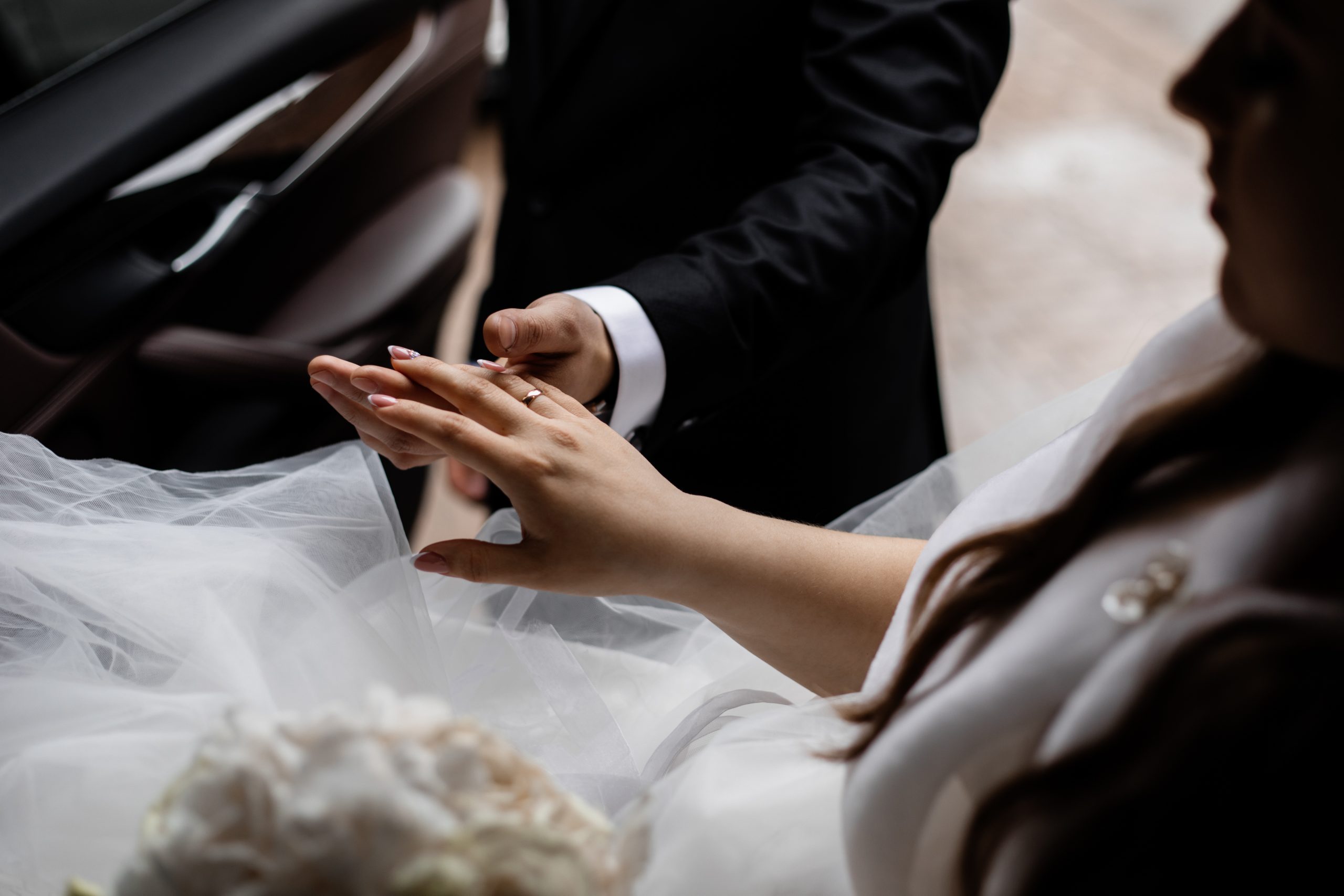 Couple holding hand in the back of a Wedding Limo
